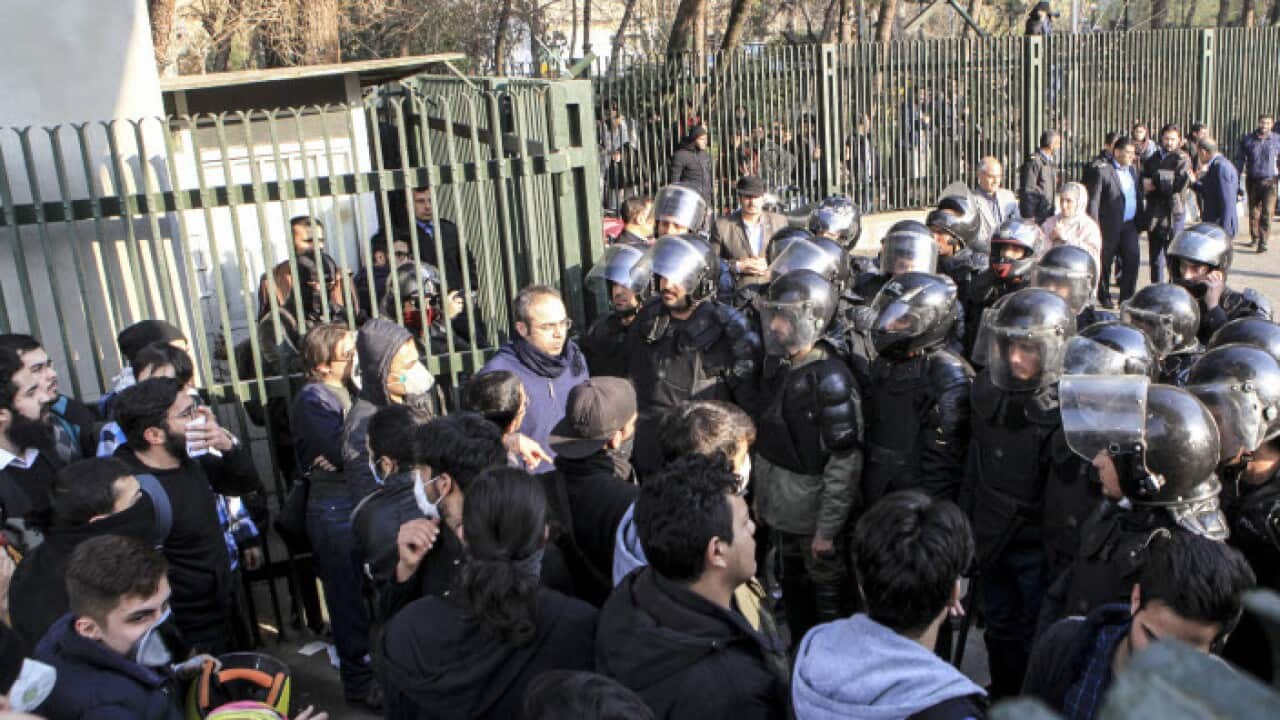 anti-riot Iranian police prevent university students to join other protesters over Iran weak economy, in Tehran, Iran