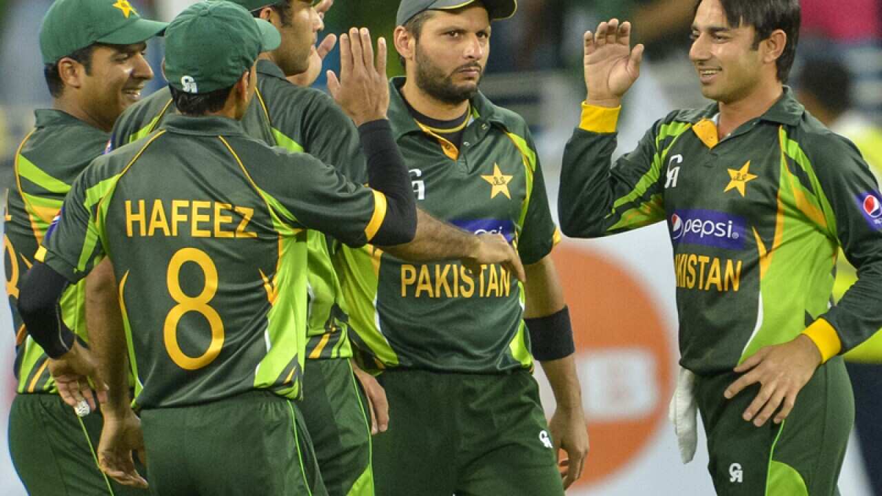 Pakistan crickets celebrate taking a wicket