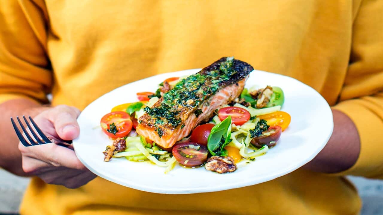 Basil butter grilled salmon with fennel and tomato salad