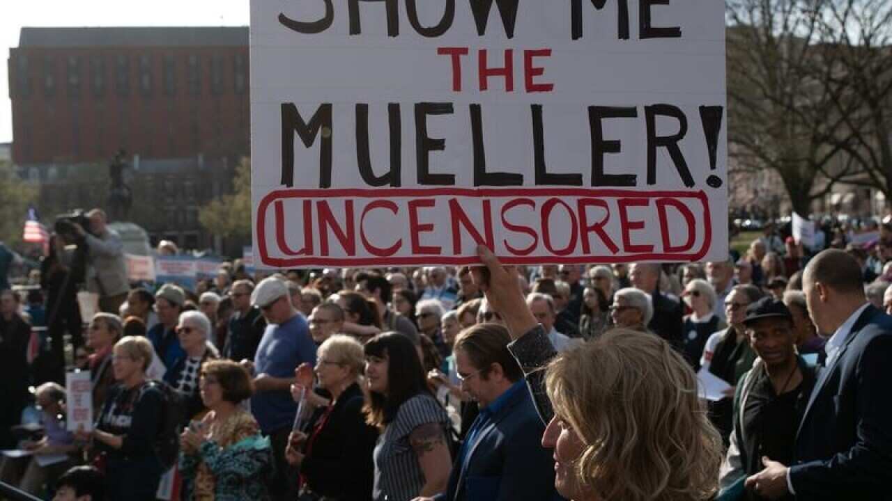 A file image of a protest calling for the release of the full report