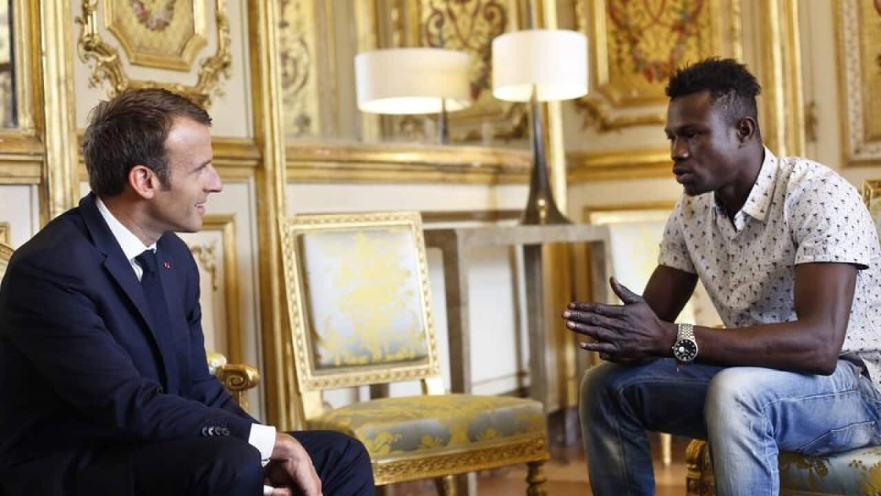 French President Emmanuel Macron meets with Mamoudou Gassama