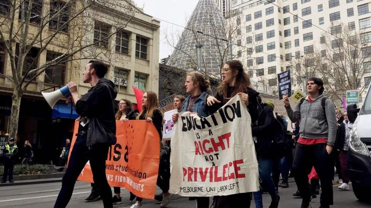 Hundreds of protesters gather outside the State Library of Victoria
