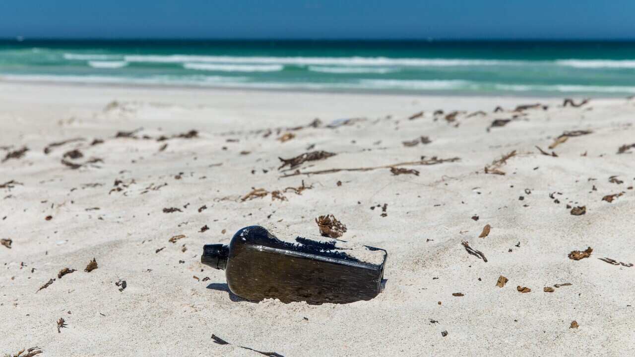 The world’s oldest known message in a bottle, found at a West Australian beach nearly 132 years after it was tossed overboard into the Indian Ocean (AAP)