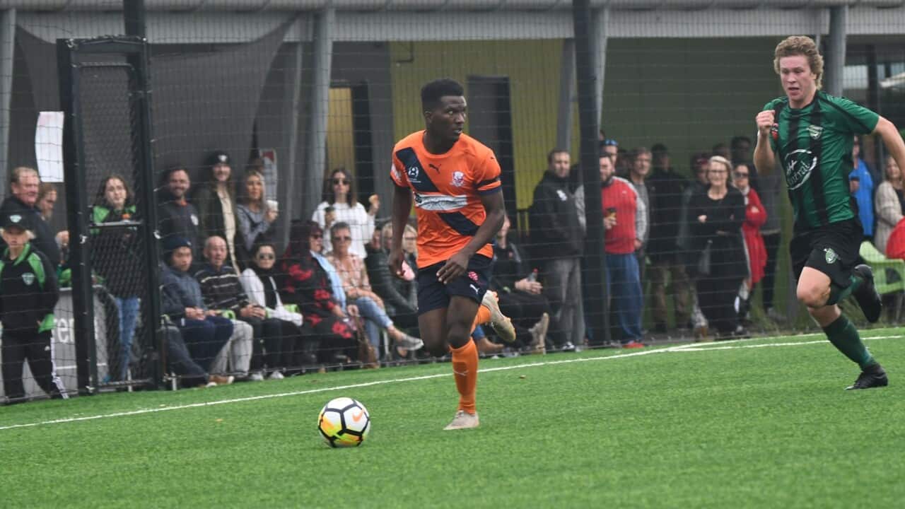 Aaron Niyonkuru controlling the ball while playing at Speers point facility in Newcastle, Australia.