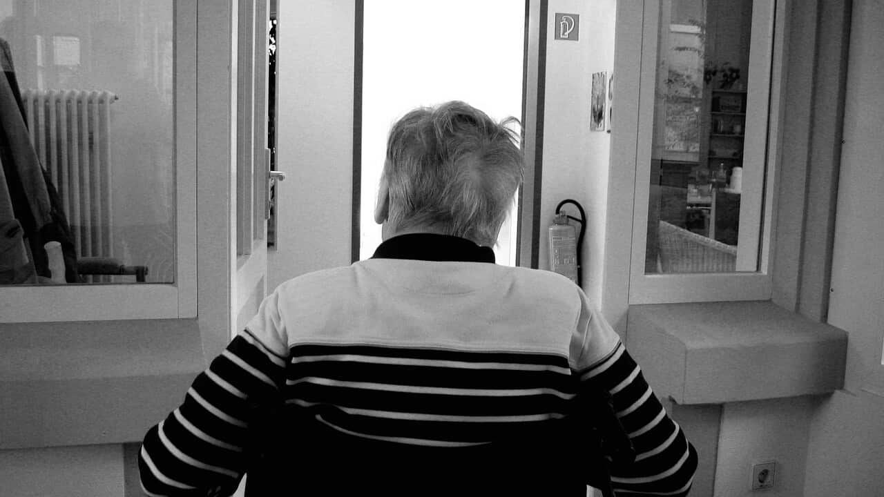 An elderly man in an aged care facility.