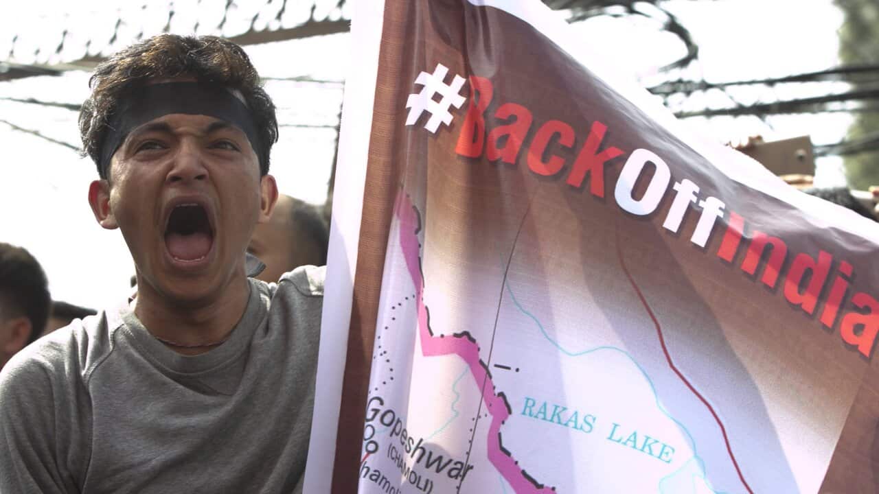 A Nepalese student shouts slogans during a protest near the Indian embassy in Kathmandu, Nepal, Friday, Nov. 8, 2019.
