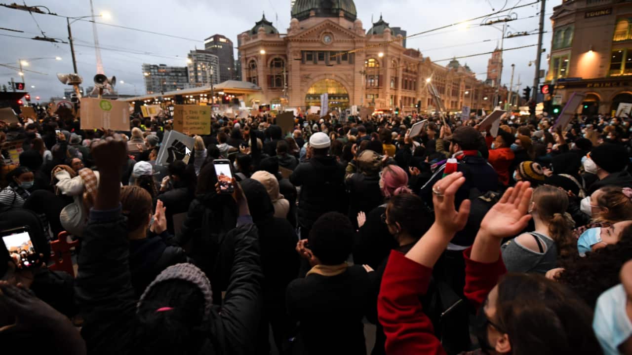 Protesters are seen during a Black Lives Matter rally in Melbourne on 6 June.