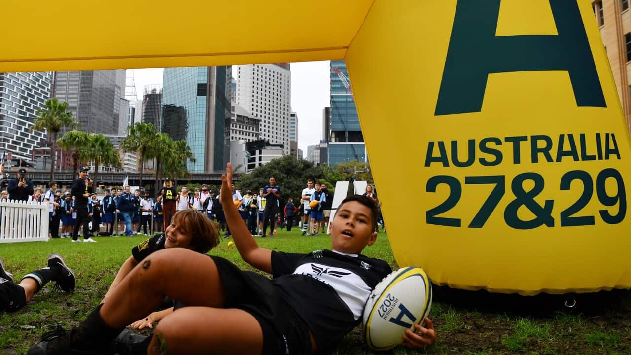 School children show off their Rugby skills following the announcement that the 2027 Men’s and the 2029 Women’s Rugby World Cup tournament will be held in Australia in Sydney, Friday, May 13, 2022. (AAP Image/Dean Lewins) NO ARCHIVING