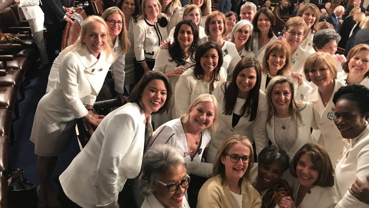 Women in white gather for the 2019 State of the Union address. 