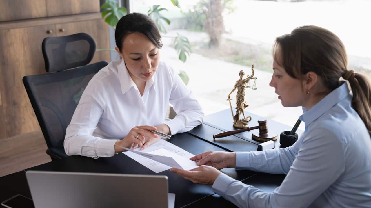 Female legal advisor lawyer helping her client