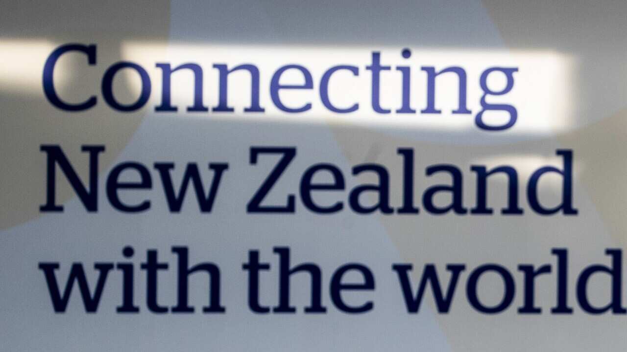 Passengers arrive at Auckland's International Airport, in Auckland, New Zealand, Wednesday, March 16, 2022.