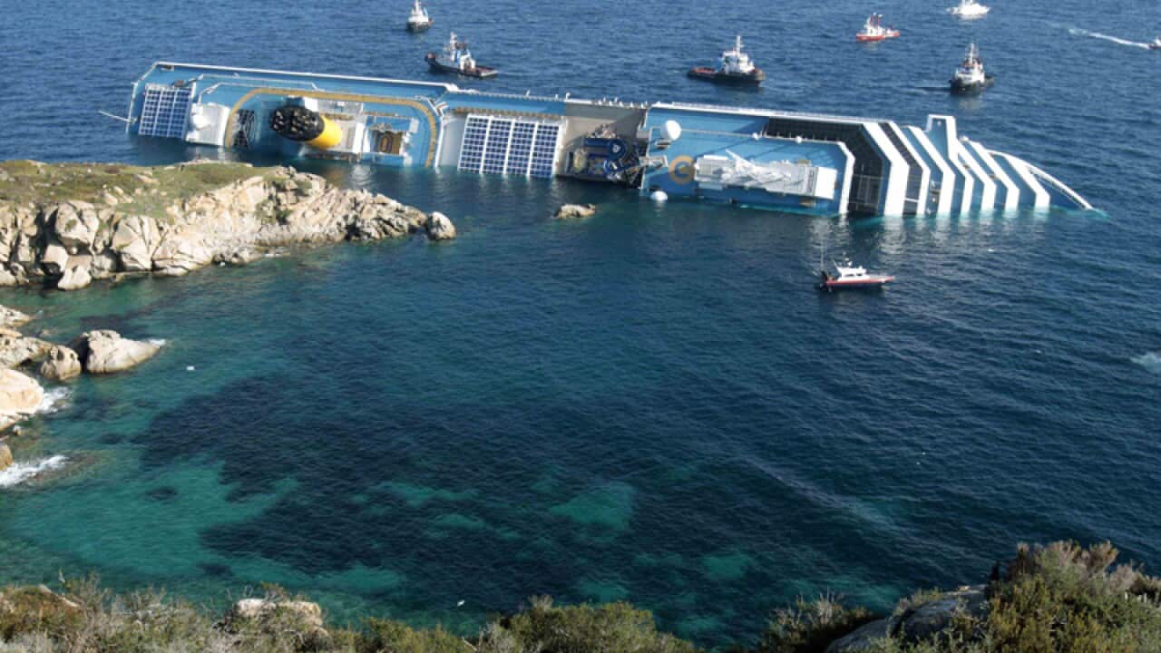 Costa Concordia leaning on its side after running aground in 2012