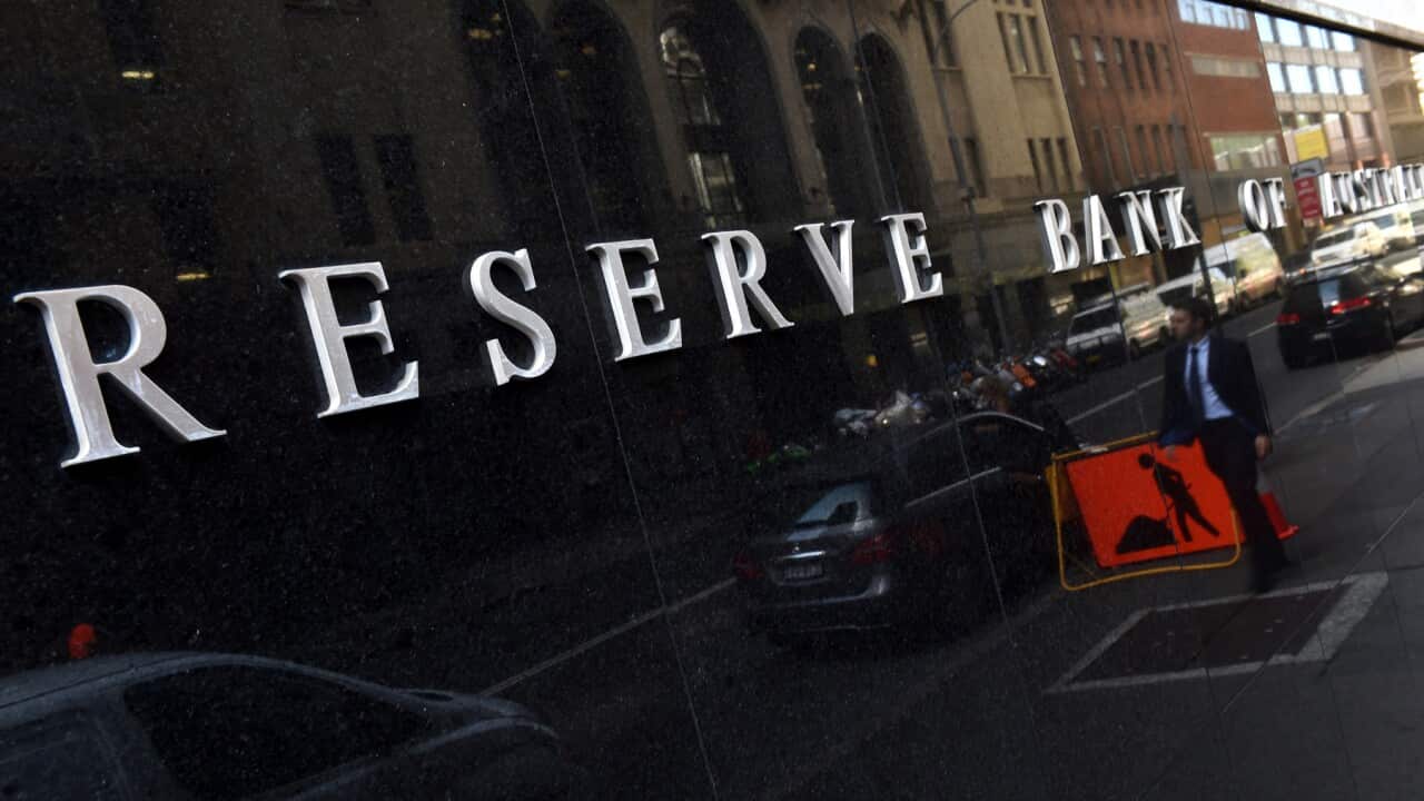 People walk past the Reserve Bank of Australia (RBA) in Sydney, Tuesday, April 6, 2016. The RBA is expected to leave interest rates on hold today. (AAP Image/Dean Lewins) NO ARCHIVING