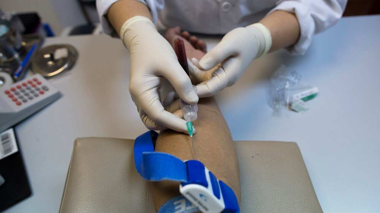 Taking a blood sample to test for HIV