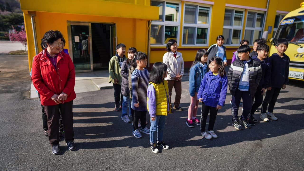 Hwang Wol-geum, 70, left corner, participates in a school trip with other grandmothers and her grandchildren in Gangjin County, South Korea.