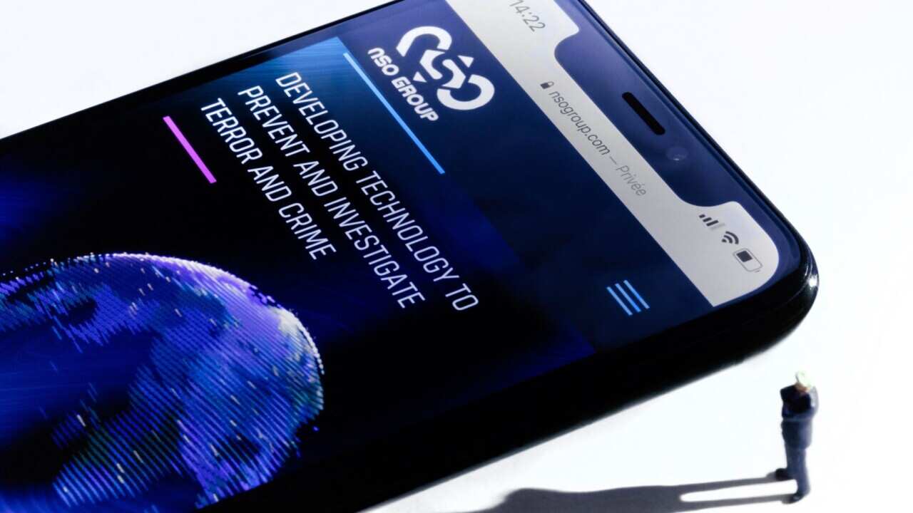 smartphone with the website of Israel's NSO Group which features 'Pegasus' spyware, on display in Paris on July 21, 2021