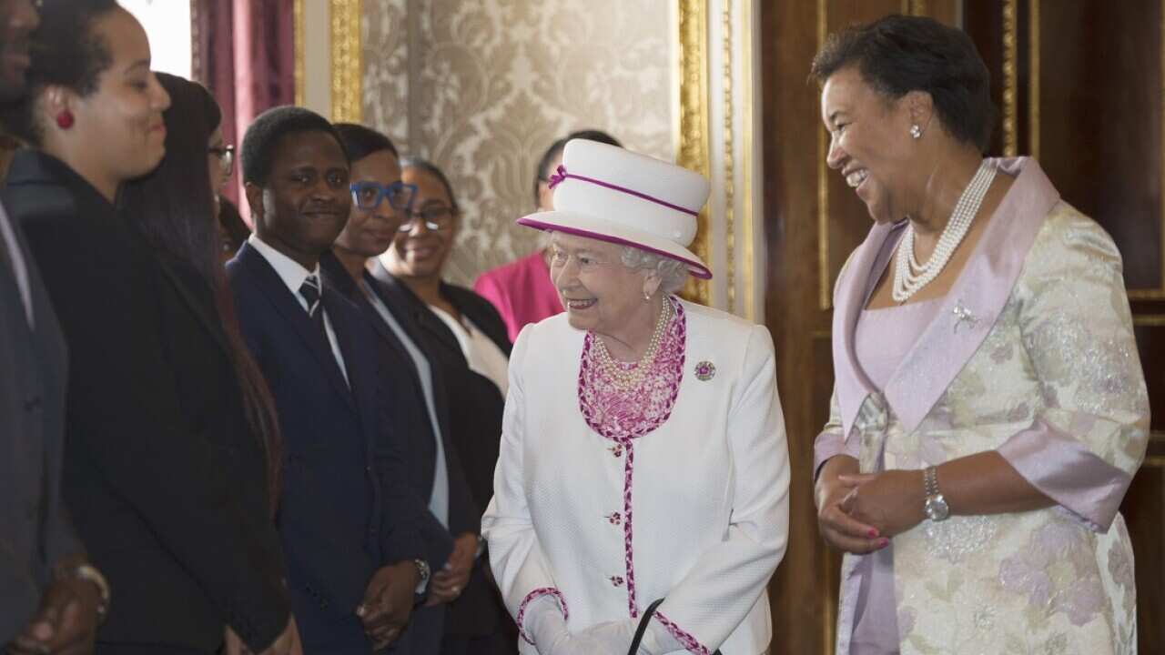 The Queen (left) and the Commonwealth Secretary General Patricia Scotland QC (right).