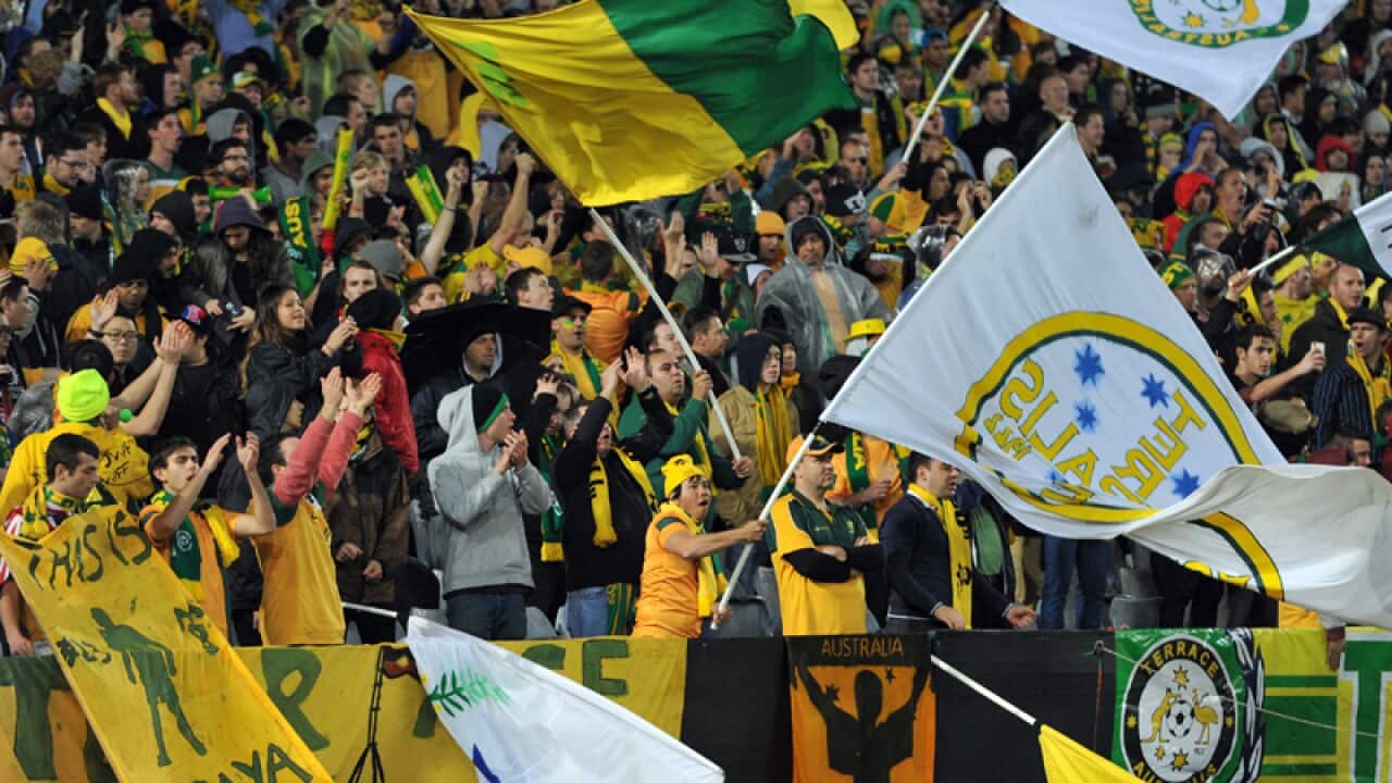 Thousands of fans braved the rain to watch the World Cup Qualifier. (AAP)