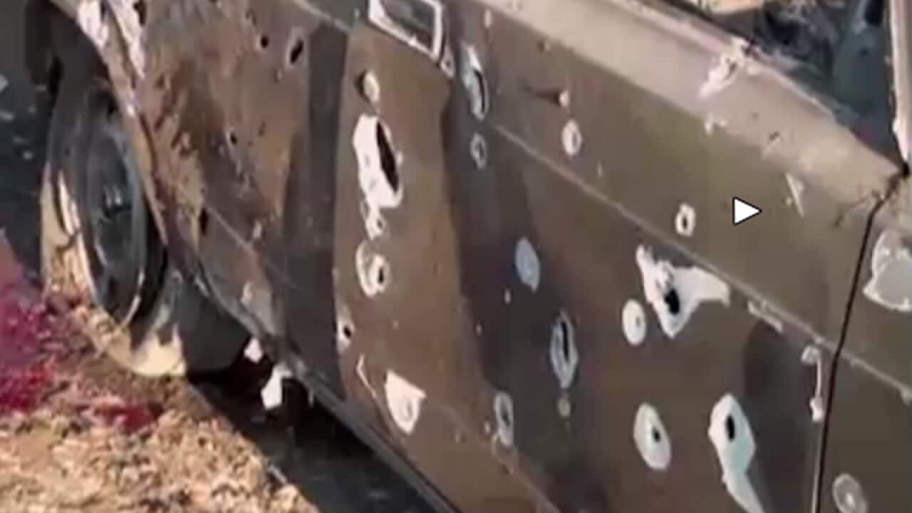 A car with blood showing in the aftermath after heavy fighting