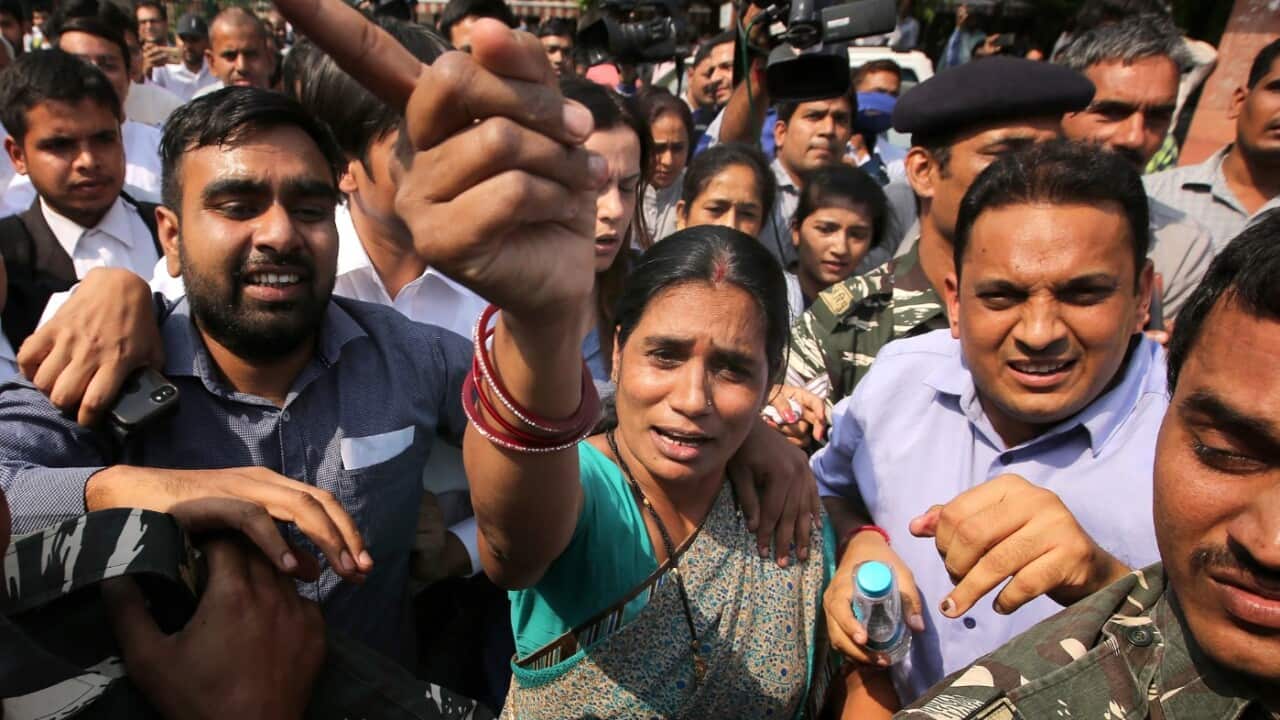 Mother (C) of murdered 2012 gang rape victim leaves Supreme Court after the judgment in New Delhi, India, 05 May 2017. 