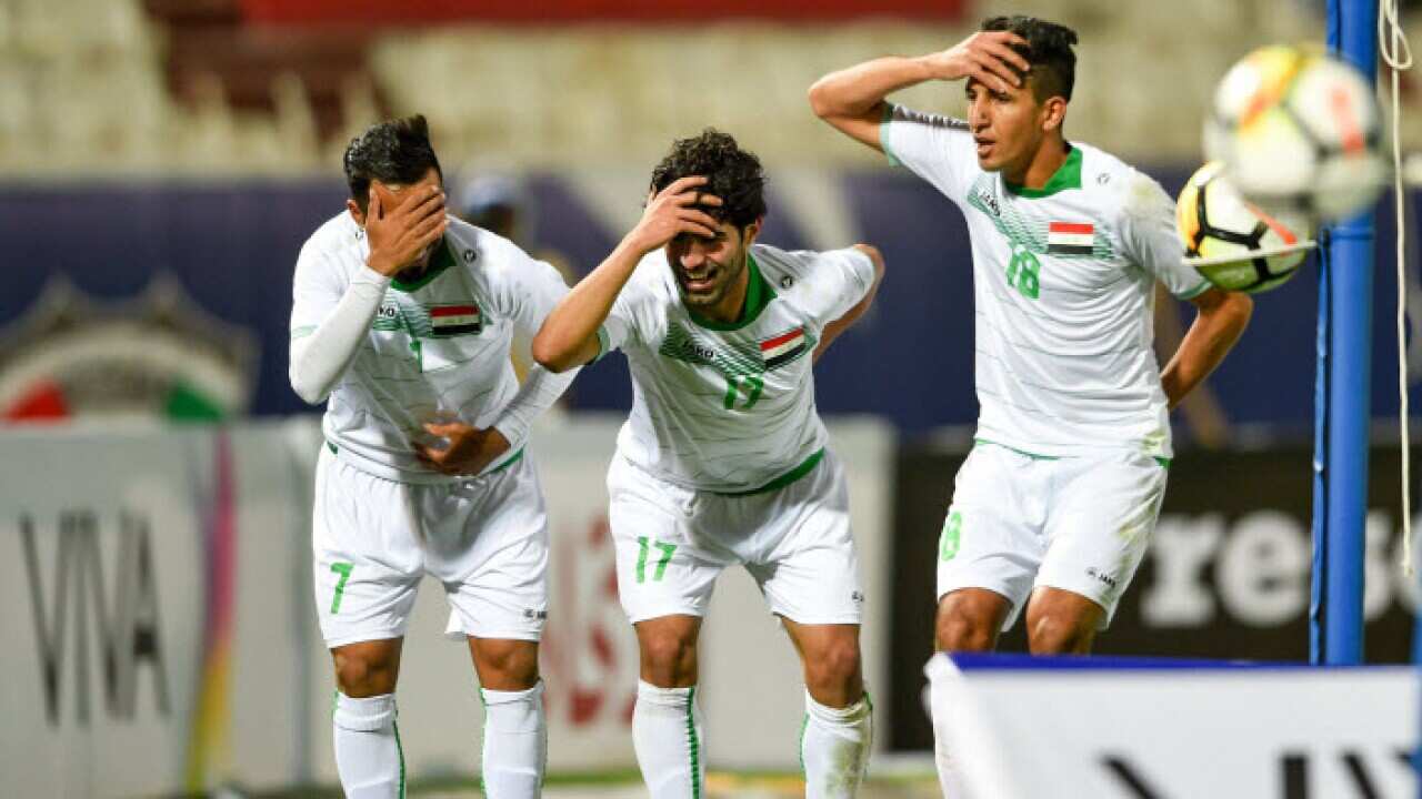 Iraq player celebrates after scoring during the Gulf Cup of Nations soccer match between Iraq and Qatar at Al Kuwait sports club Stadium, Kuwait City, Kuwait