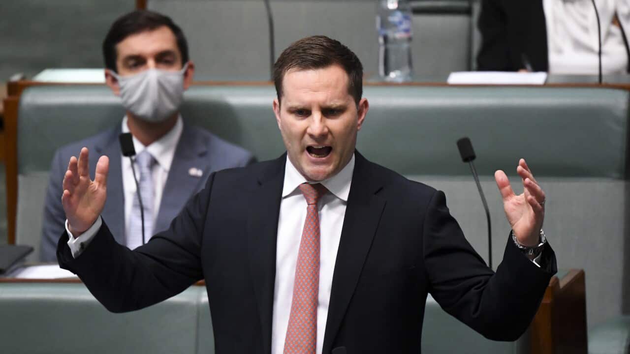 Immigration Minister Alex Hawke speaks during Question Time at Parliament House in Canberra.