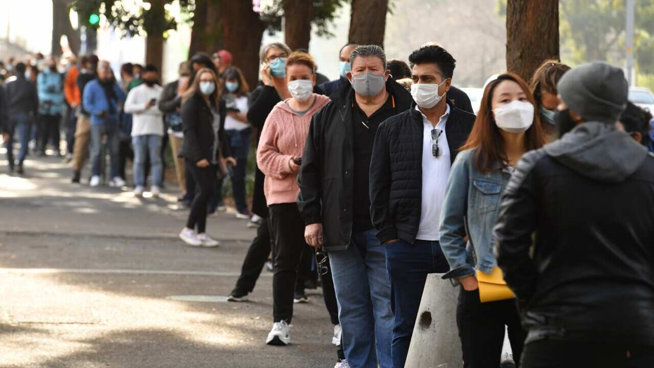 People queue at the NSW Vaccine Centre at Homebush Olympic Park in Sydney