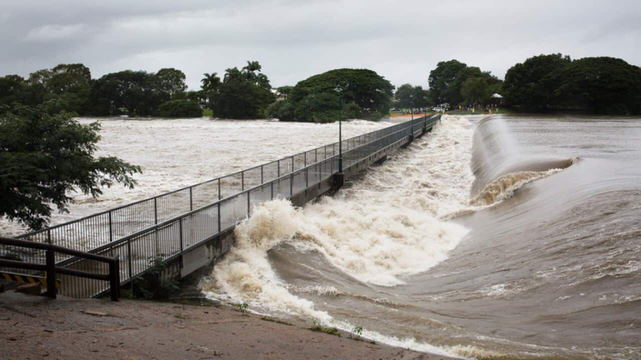 Floodwaters are seen at Aplins Weir in Townsville