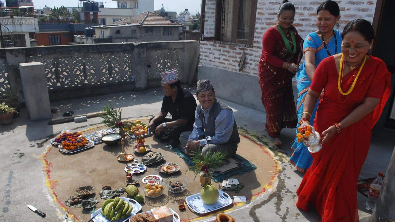 Nepalese women pay respects to their brothers on the occasion of Bhai Tika - brothers' worship - on the last day of the Hindu festival of Tihar in Kathmandu on October 30, 2008.