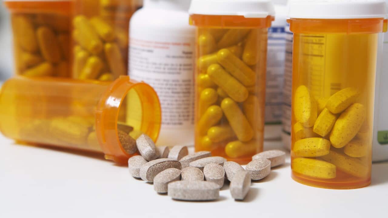 Bottles of pills one spilling close-up