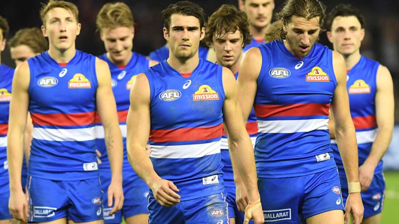 Bulldogs players leave the ground