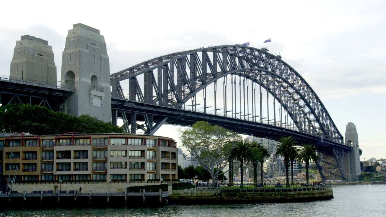 (SYD972) Stock. 1st July, 2000. Stock images from around Sydney's Rocks District and Circular Quay. Sydney Buses line up along George Street. Sydney Harbour Bridge and the Hyatt Hotel, Circular Quay.(AAP PHOTO/Dean Lewins)