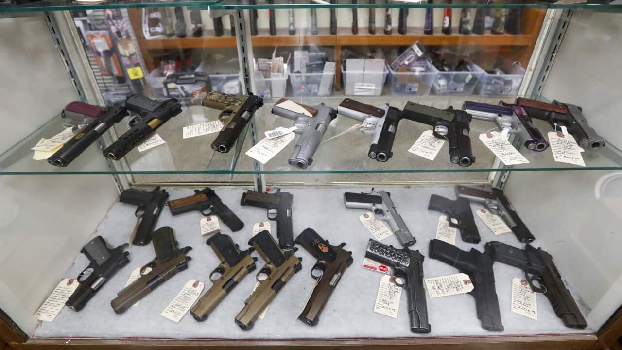 Semi-Automatic handguns are displayed at a US sport shop.