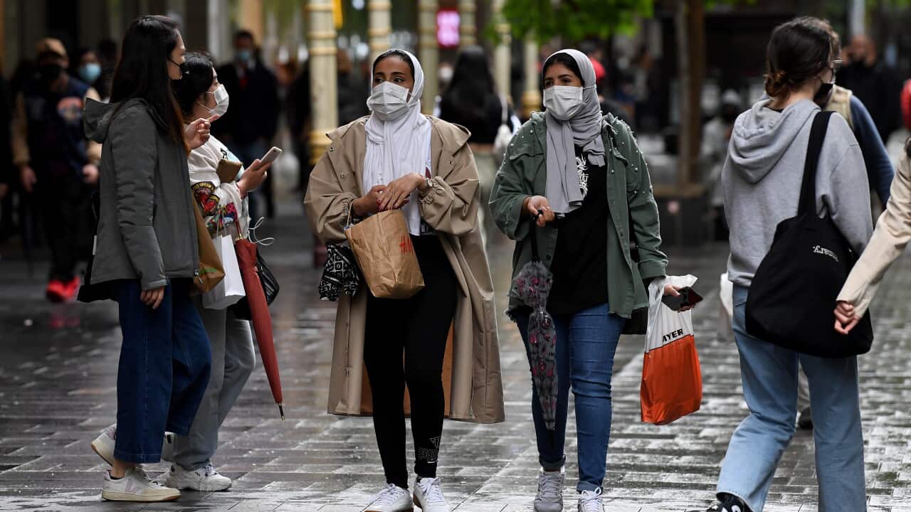 Shoppers wearing face masks walking through Pitt St Mall
