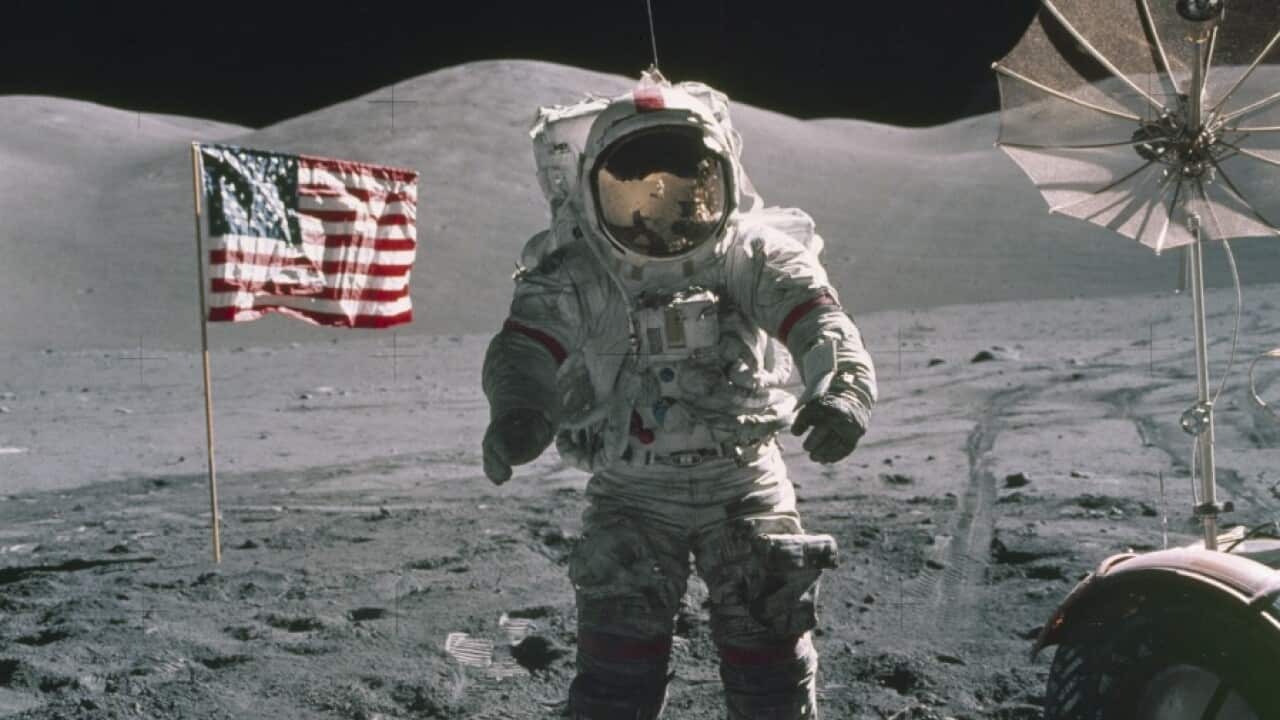 A NASA space agency image shows Apollo 17 Mission Commander Eugene A. Cernan standing near the lunar rover in 1972