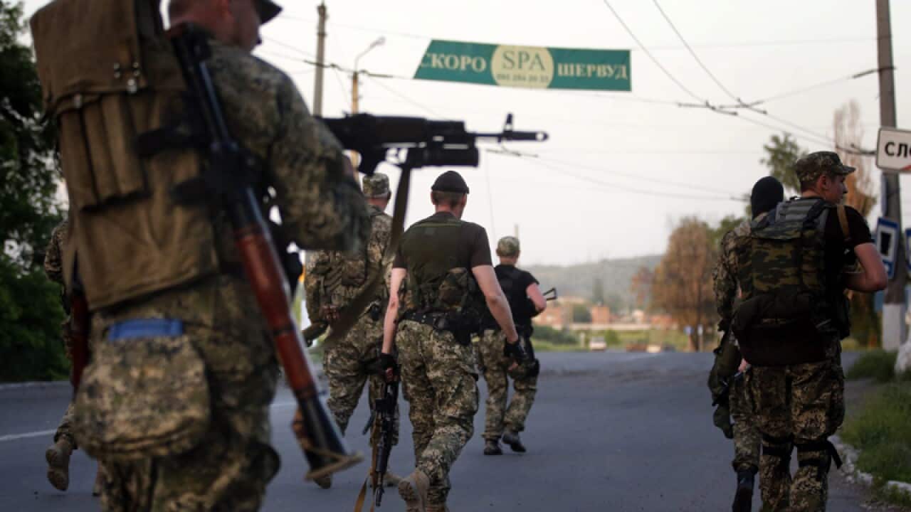 Armed pro-Russian militants move to positions