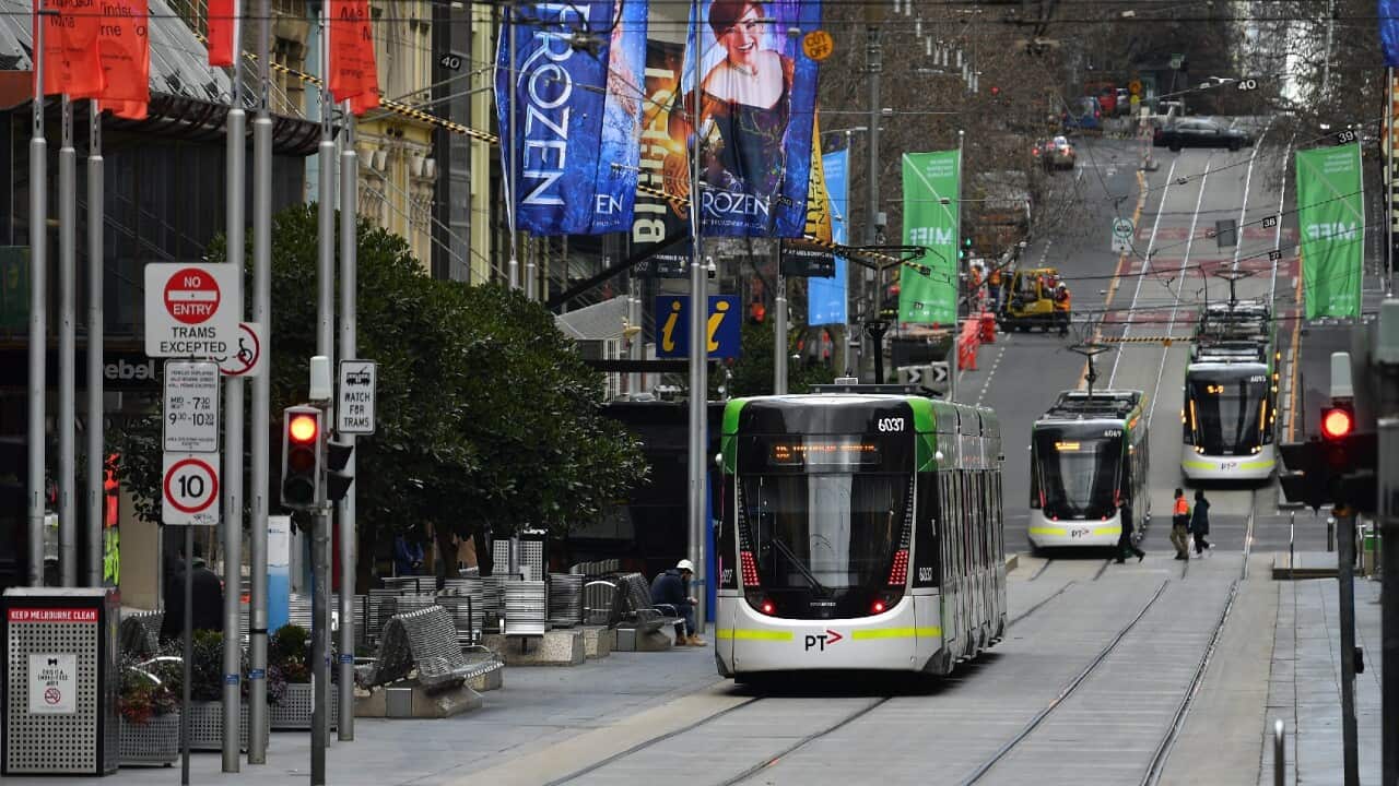 Trams pictured along Bourke Street in Melbourne on 23 July, 2021. 