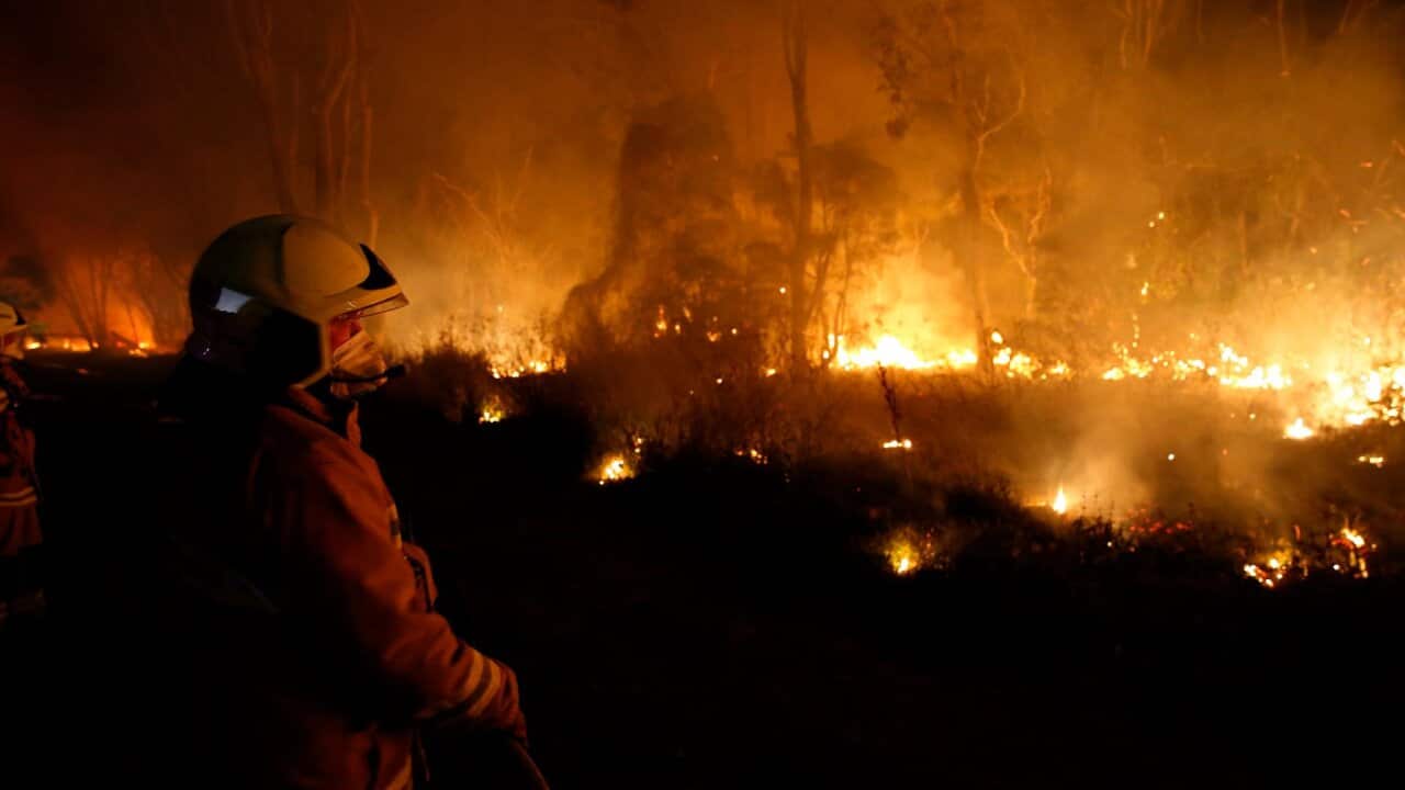 Fireman struggling to contain bushfire