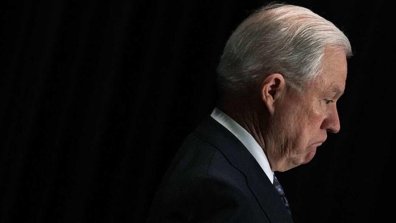 Attorney General Jeff Sessions listens as he is introduced 