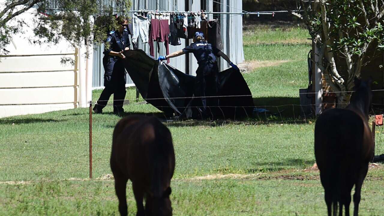 Police officers search the foster home of Tiahleigh Palmer