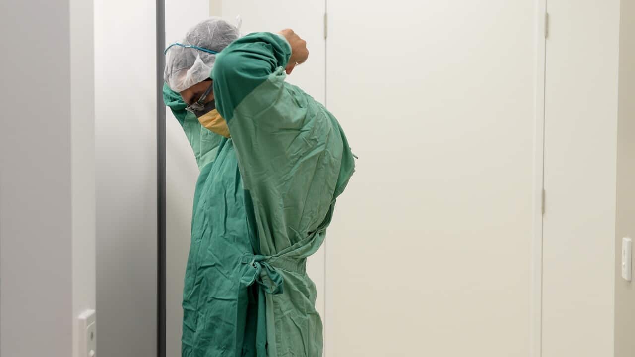 A surgeon prepares for theatre