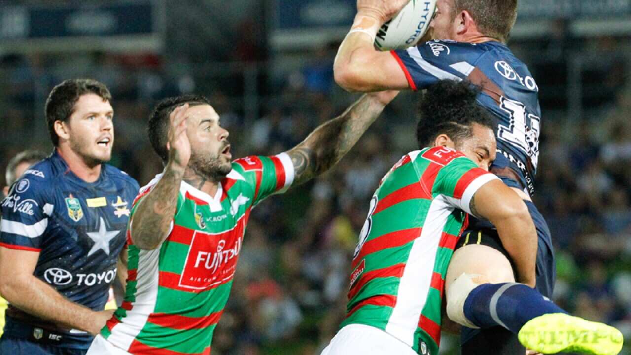 Rabbitohs Angus Crichton tackled by Cowboys