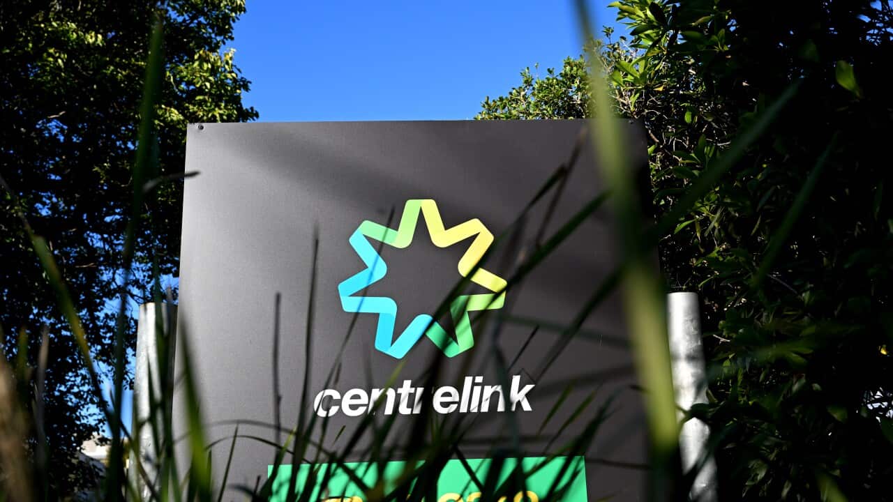 The Centrelink logo on a sign.