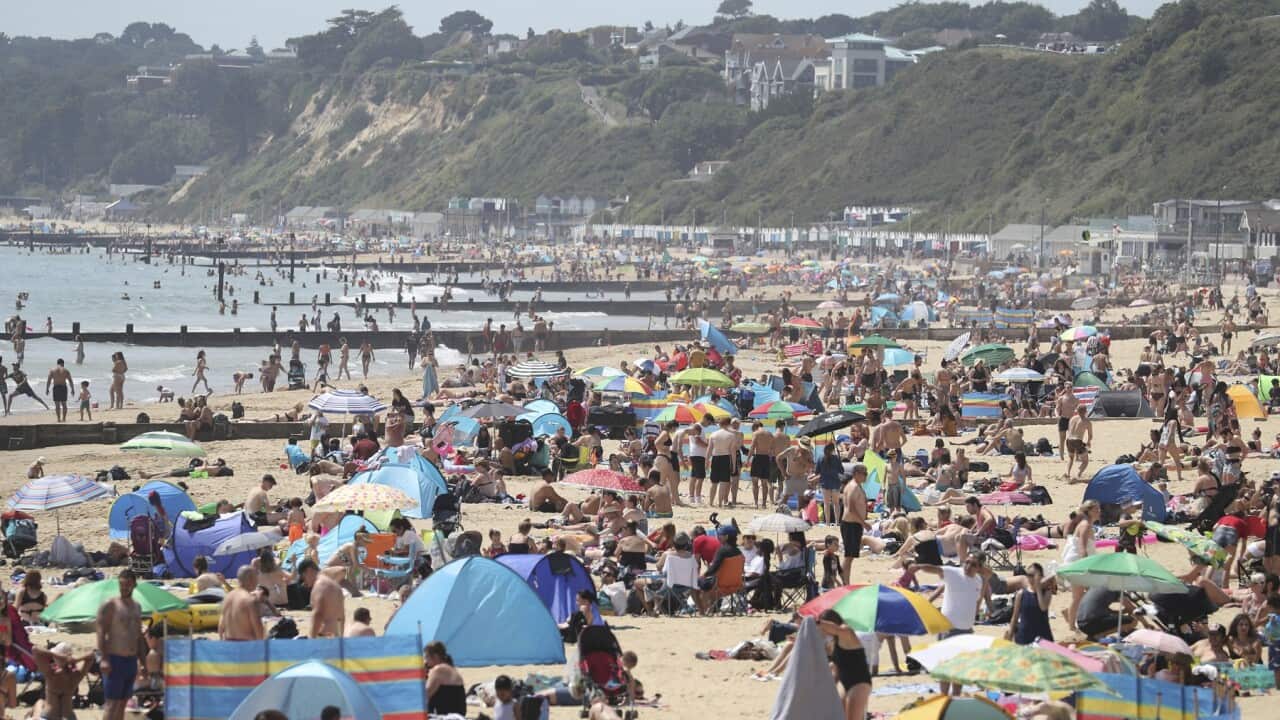 Britons crowd on to the beach in Bournemouth, south England