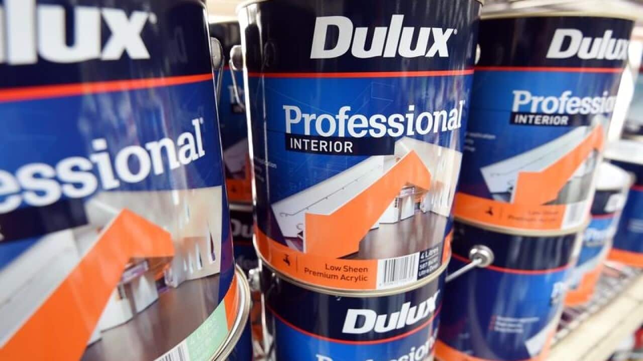 Dulux paint cans are pictured at a store in Brisbane.