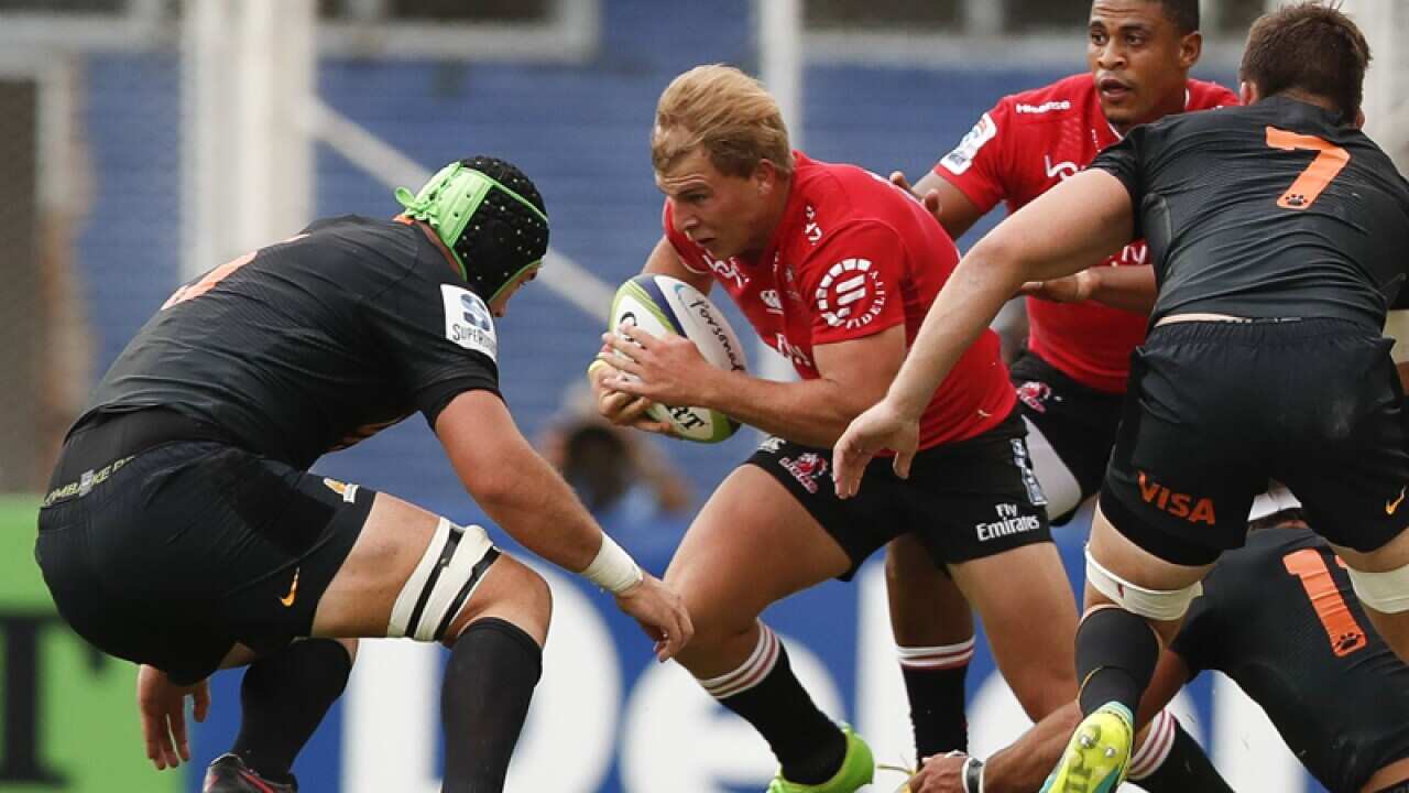 Lions' player Jaco van der Walt (C) in action against Jaguares