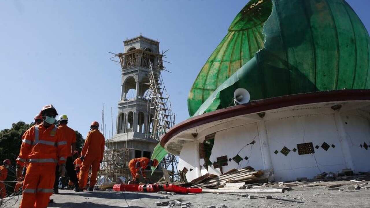 Rescuers look for suvivors