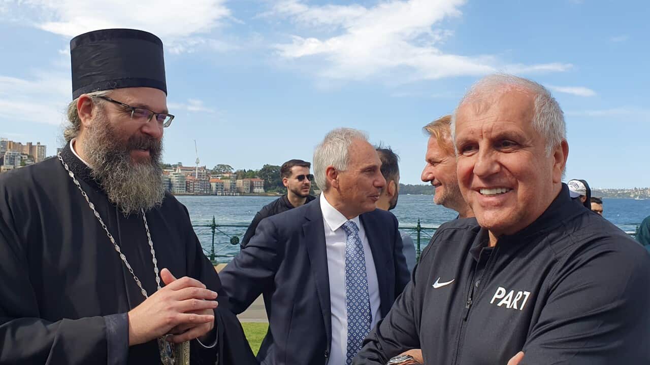 Partizan Basketball Club coach Zeljko Obradovic talks to His Grace Bishop Siluan, Serbian Orthodox Church Metropolitan for Australia and New Zealand