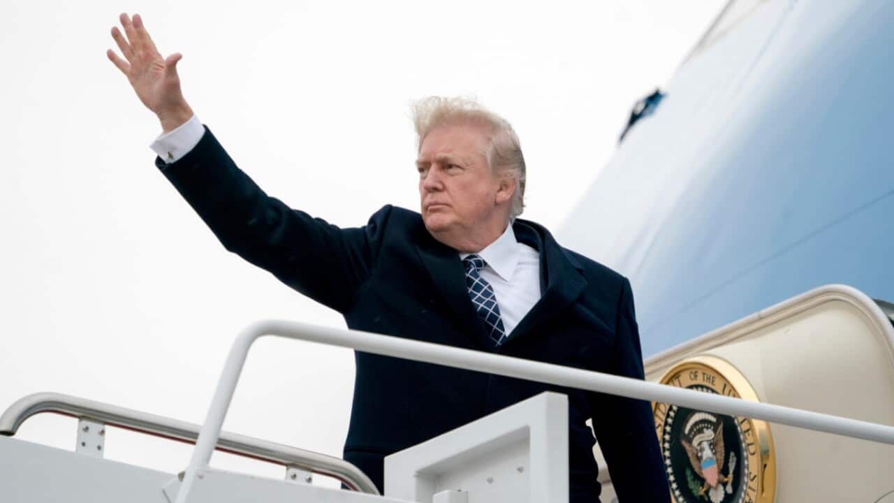 President Donald Trump waves as he boards Air Force One at Andrews Air Force Base, Md., Friday, Jan. 12, 2018