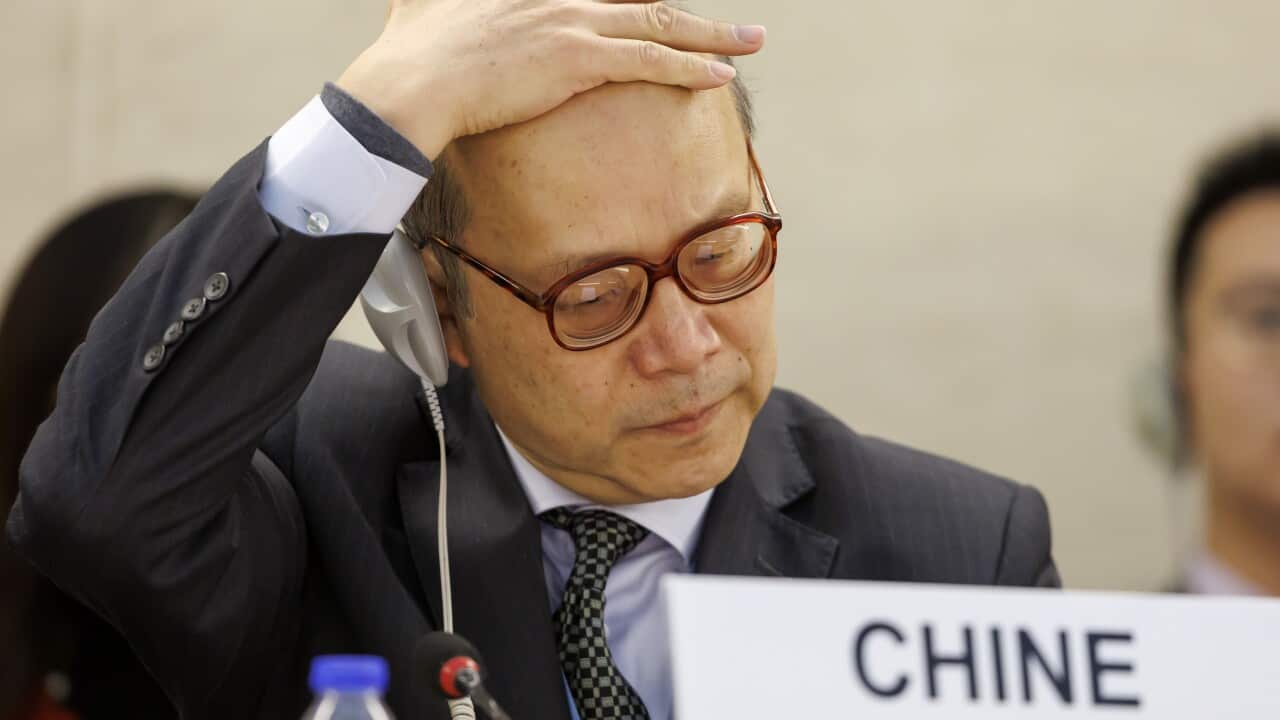 A man with his hand on his head